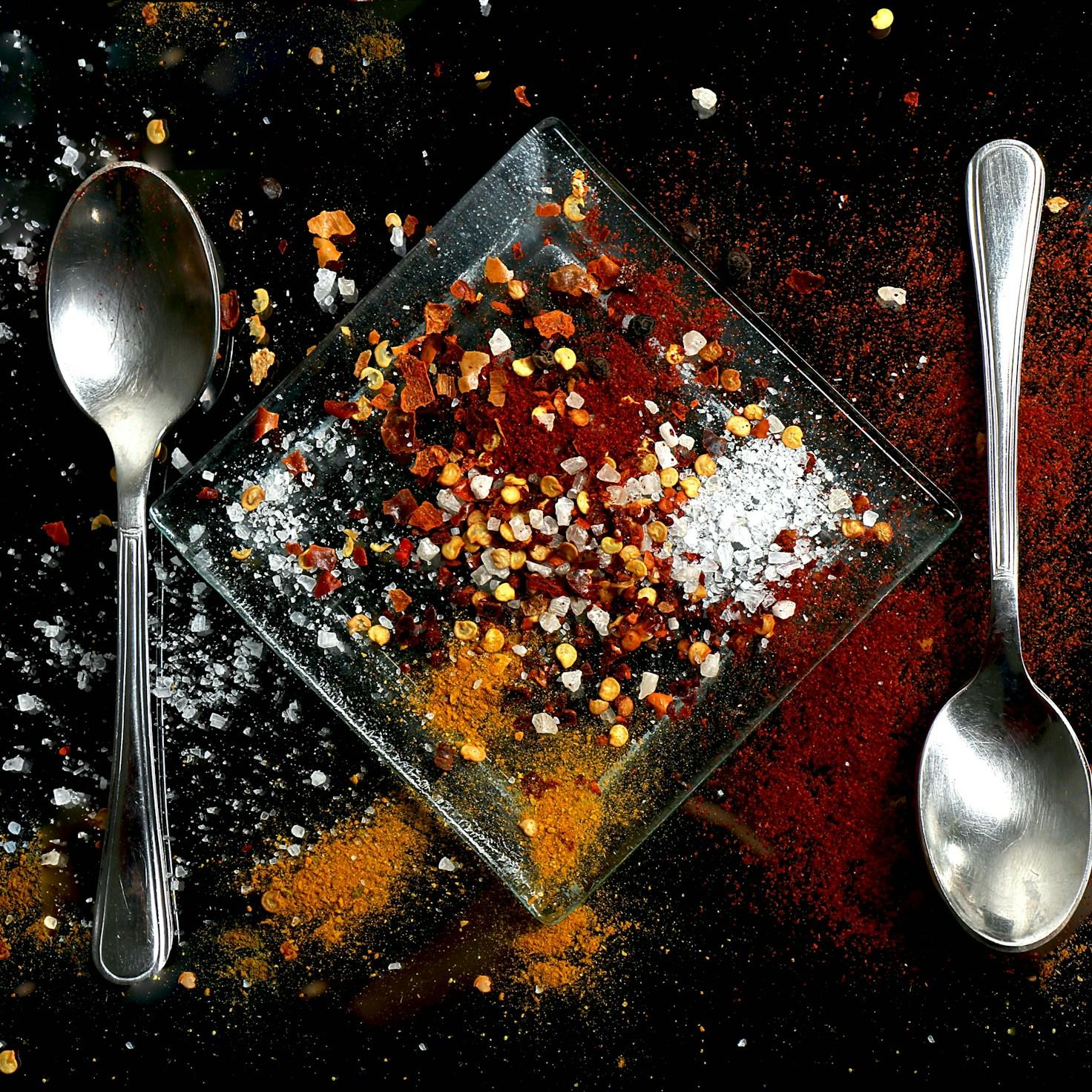 Community members collaborating in a modern kitchen space, sharing recipes and cooking techniques